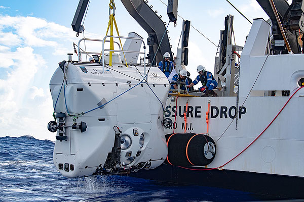 The Limiting Factor submersible being hoisted aboard its mother ship