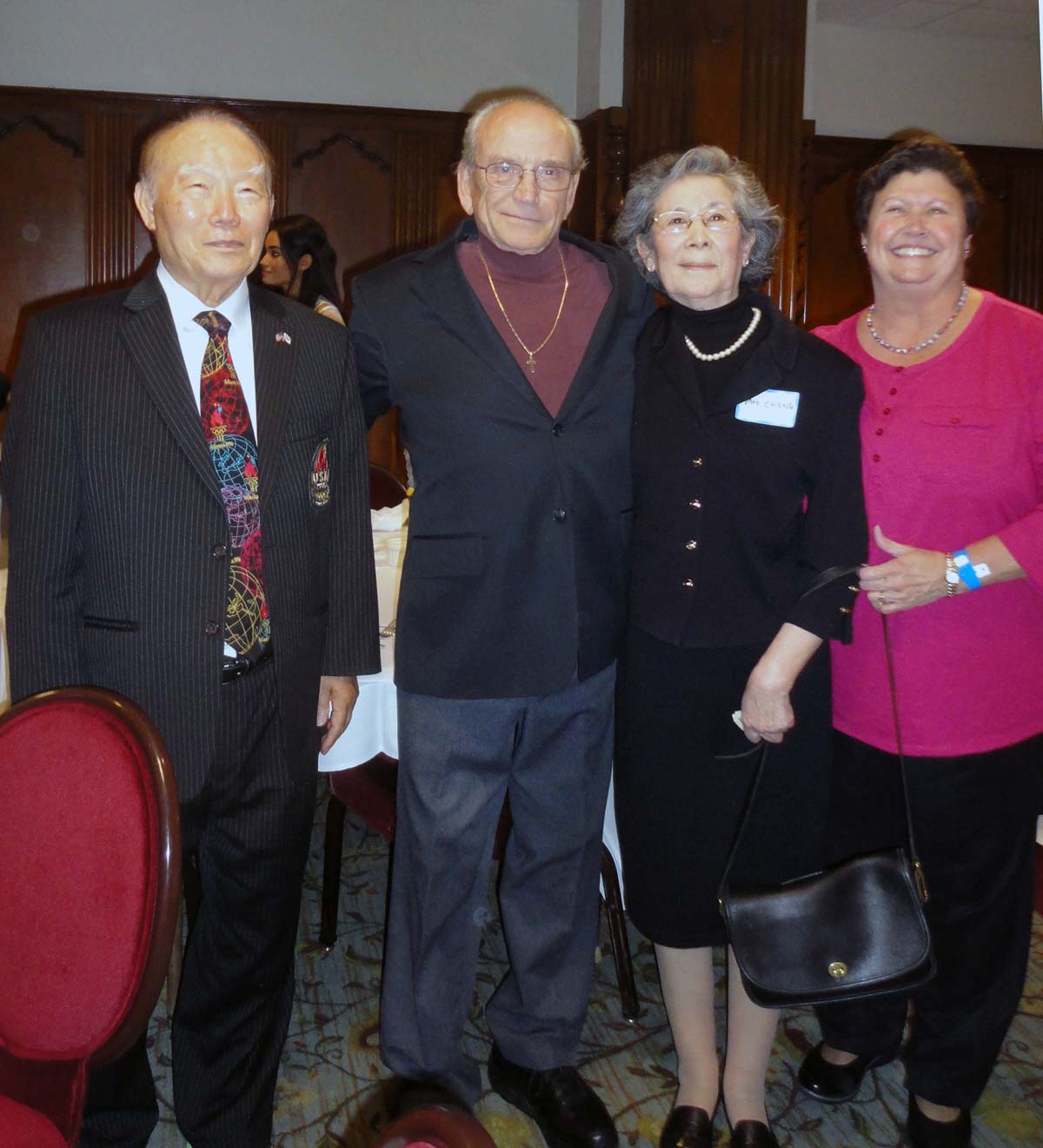 Dr. Dennis  and Mrs. Louis Burke stand beside Grand Master and Mrs. Hwa Chong at the U-Michigan Taekwondo Club’s 50th anniversary dinner on 4 October, 2014
