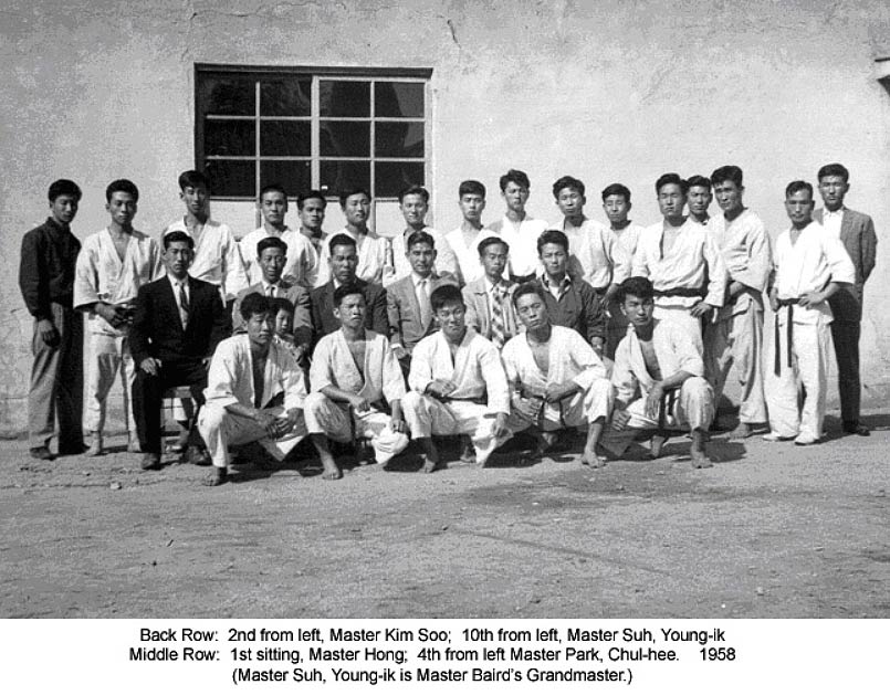 1958 test for 4th degree master's rank in Kang Duk Won. The test was supervised by Park Chul-Hee, the head of this kwan at the time. Park is seen in the center of the photograph.
